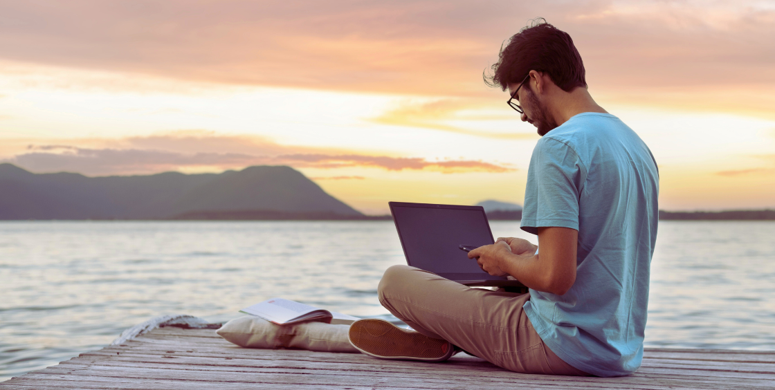 Digital nomad working on a beach